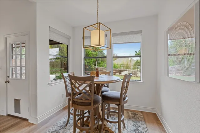 a dining room with furniture and window