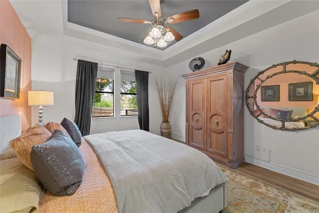 a bedroom with a bed dresser and a window