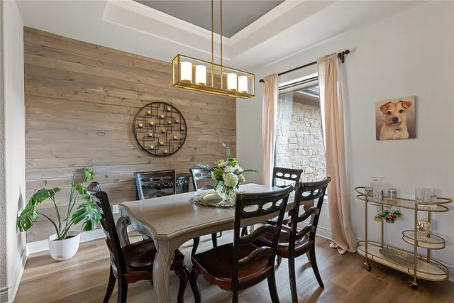 a view of a dining room with furniture and a window
