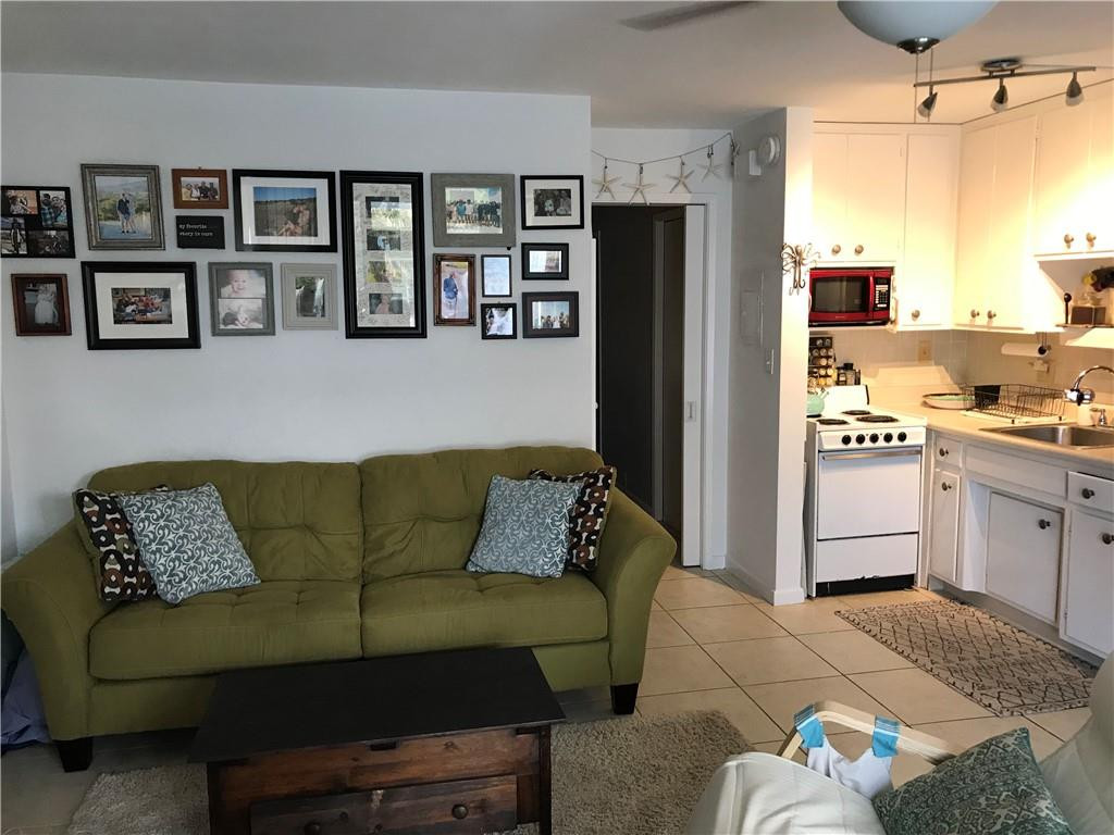 901 North Birch Road, Unit 5B Fort Lauderdale, FL 33304 - Photo 2 of 12 a living room with stainless steel appliances furniture and a window