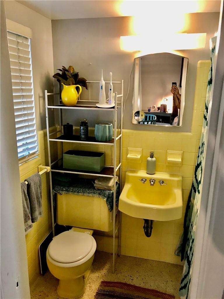 901 North Birch Road, Unit 5B Fort Lauderdale, FL 33304 - Photo 6 of 12 a bathroom with a sink and mirror