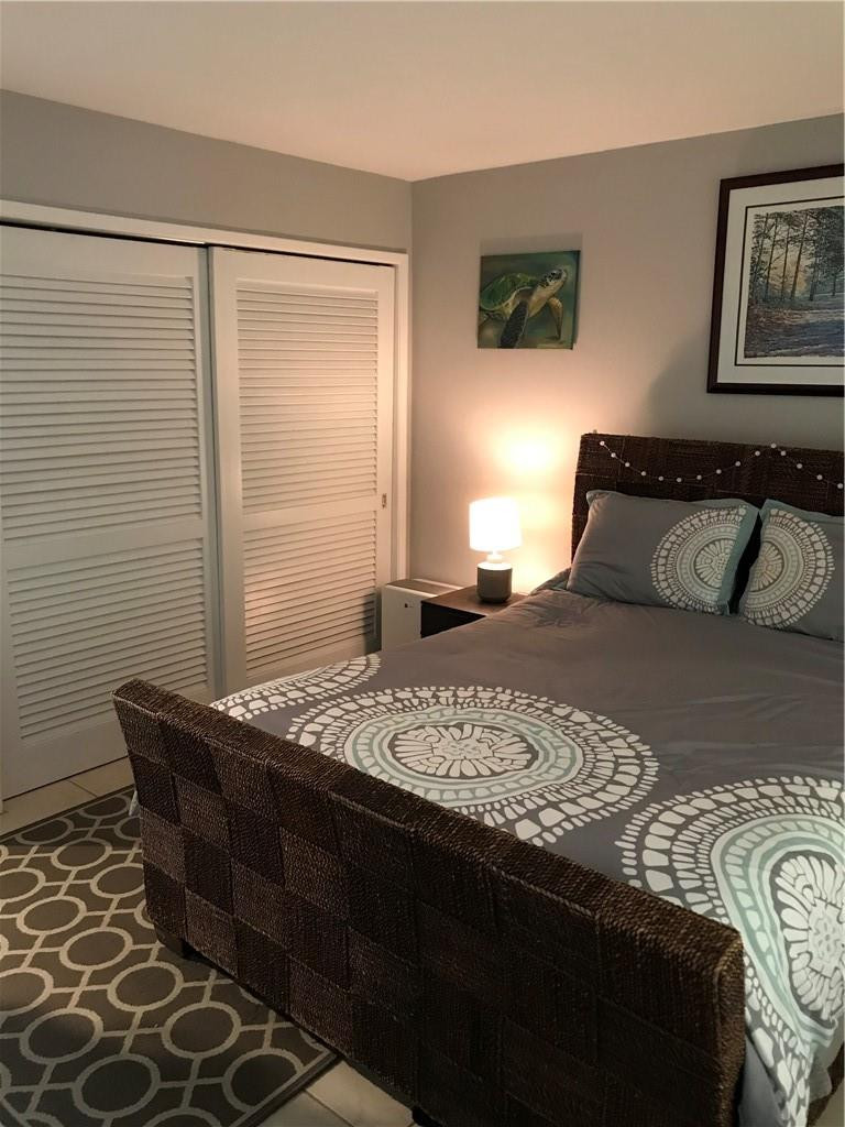 901 North Birch Road, Unit 5B Fort Lauderdale, FL 33304 - Photo 7 of 12 a bedroom with a bed and a window