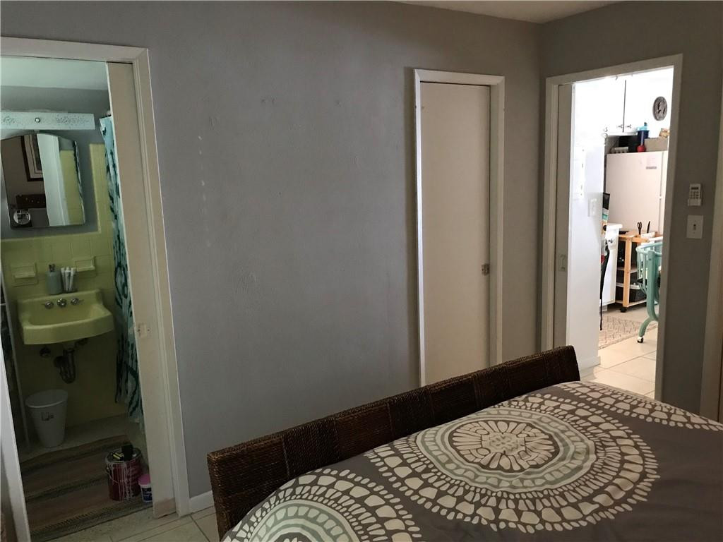 901 North Birch Road, Unit 5B Fort Lauderdale, FL 33304 - Photo 8 of 12 a bedroom with a bed and bathroom