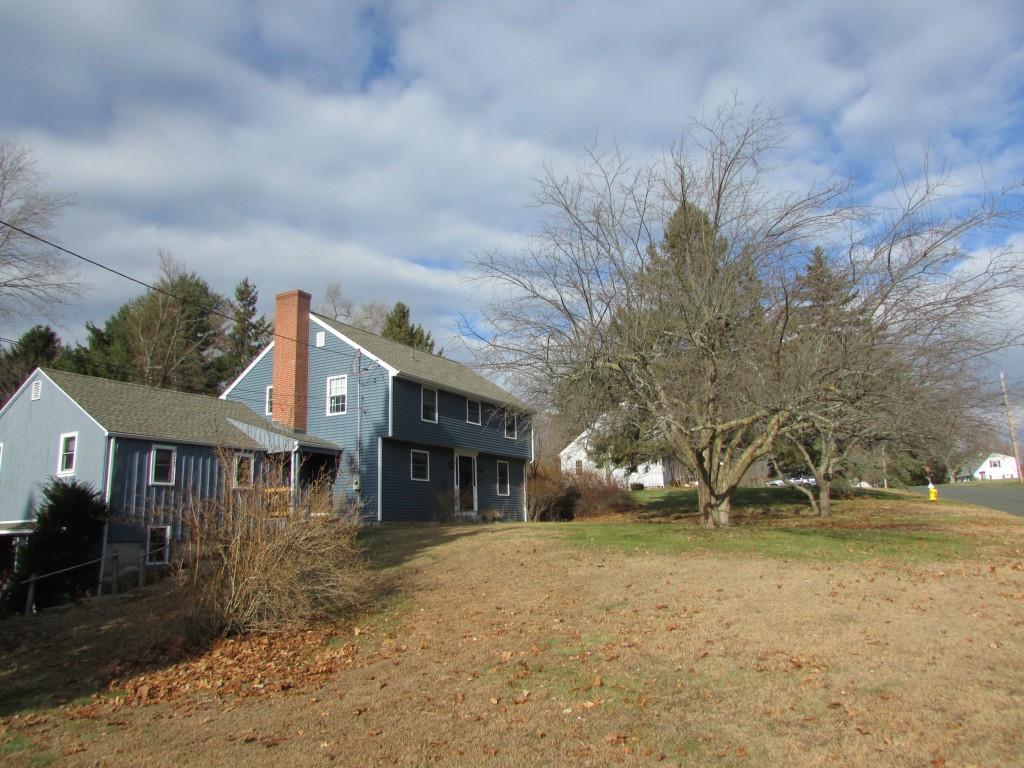 29 Plymouth Road Somers, CT 06071 - Photo 1 of 1 a front view of a house with a yard and garage