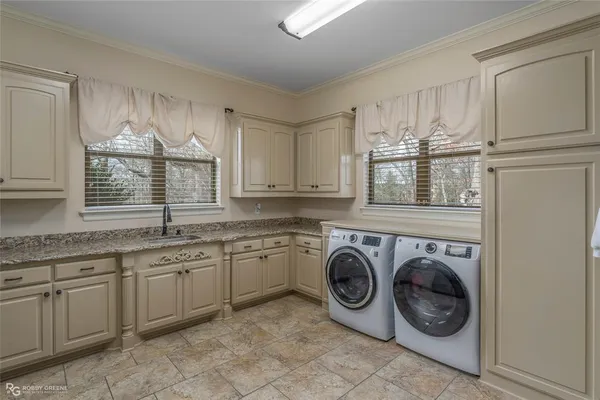 a kitchen that has a sink and a stove