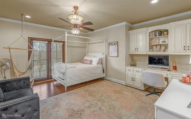 a bathroom with a granite countertop toilet a sink a mirror a bathtub and shower
