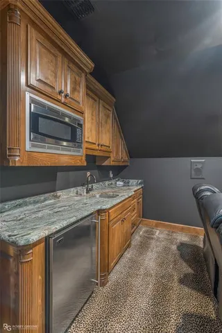 a workspace with furniture and chandelier