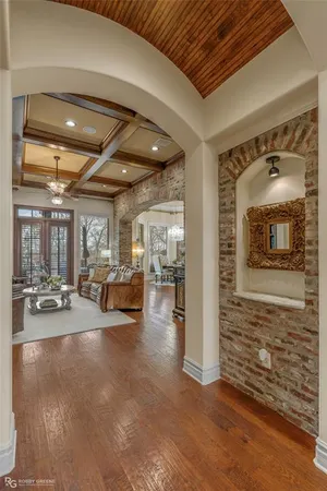 a view of a livingroom with hardwood floor and a chandelier