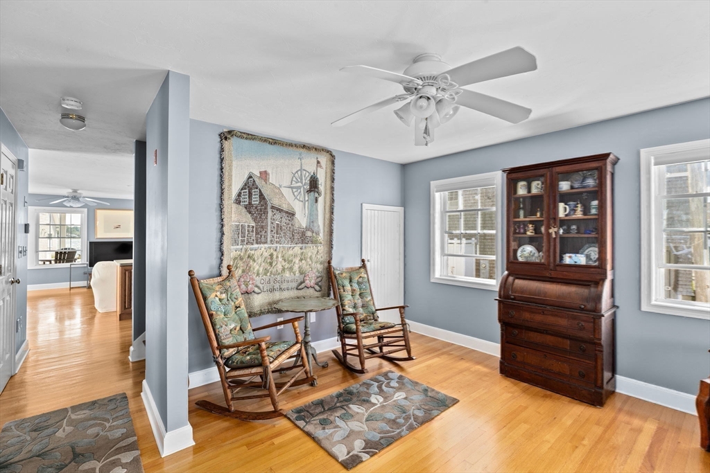 53 Lighthouse Road Scituate, MA 02066 - Photo 12 of 29 a living room with furniture and wooden floor