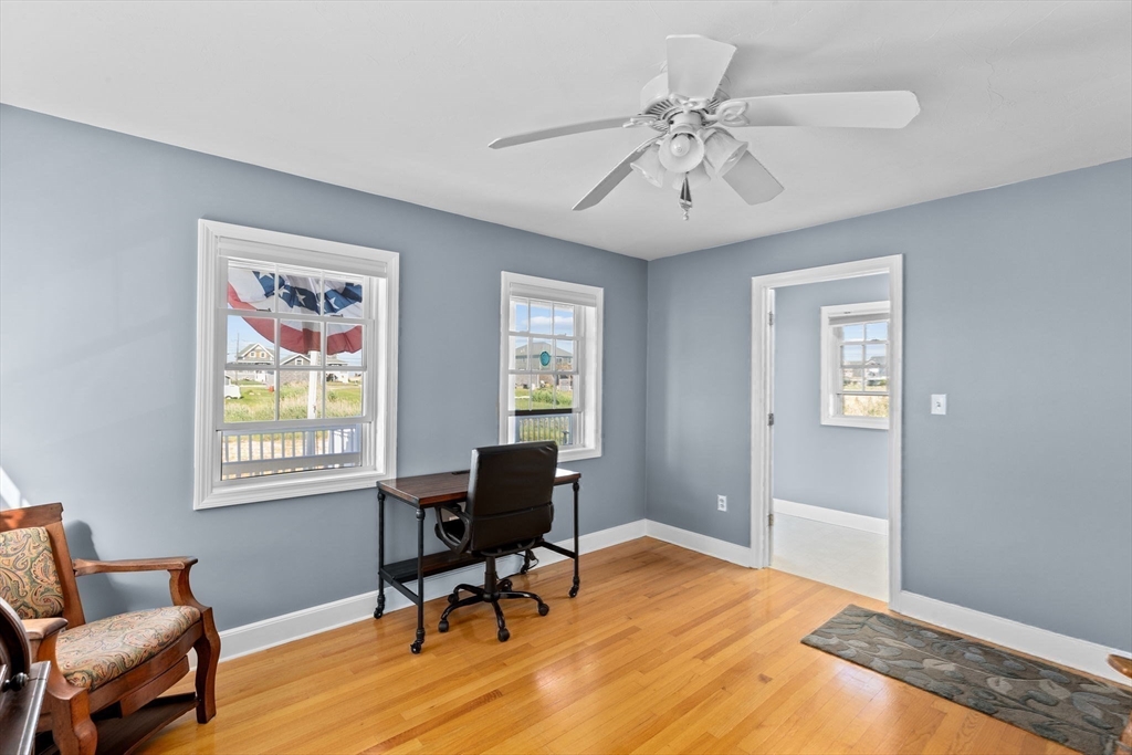 53 Lighthouse Road Scituate, MA 02066 - Photo 13 of 29 a workspace with wooden floor and a window
