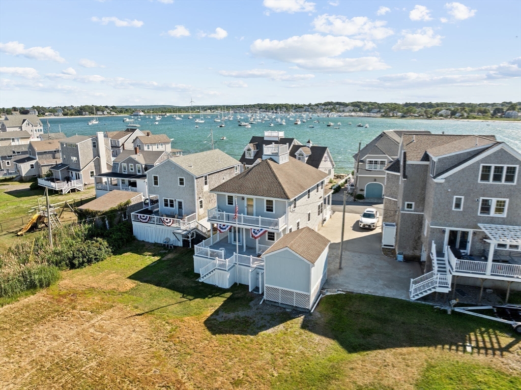 53 Lighthouse Road Scituate, MA 02066 - Photo 2 of 29 a view of a city from a terrace