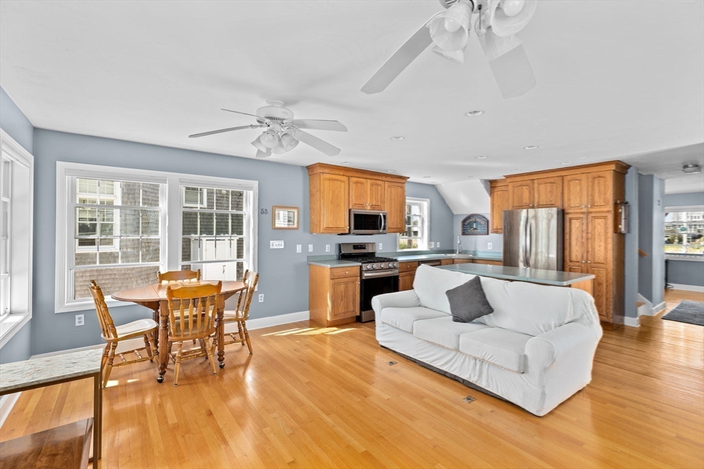 53 Lighthouse Road Scituate, MA 02066 - Photo 10 of 29 a living room with furniture and a large window