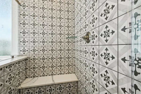 a bathroom with a bathtub and shower