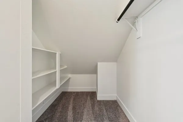 a view of an empty walk in closet