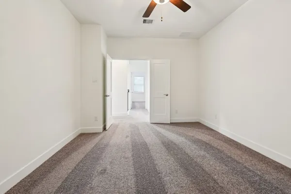 an empty room with fan