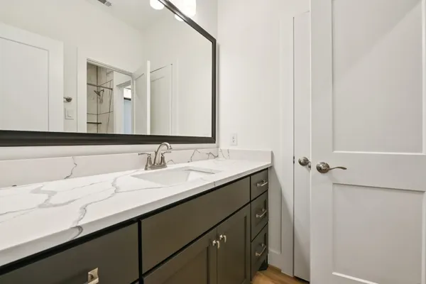 a bathroom with a sink and a mirror