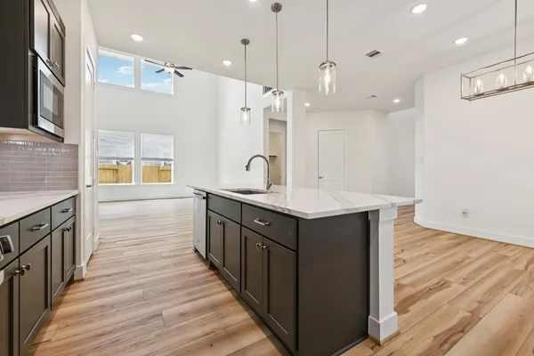 a bathroom with a double vanity sink a mirror and a shower