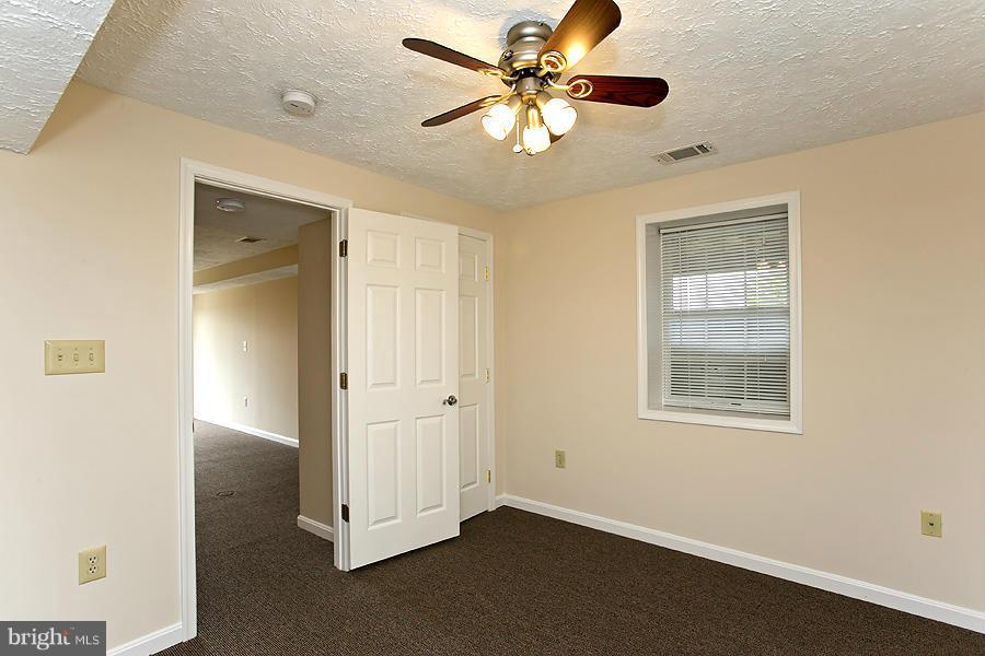 176 White Hall Road Winchester, VA 22603 - Photo 23 of 30 a view of an empty room with a window