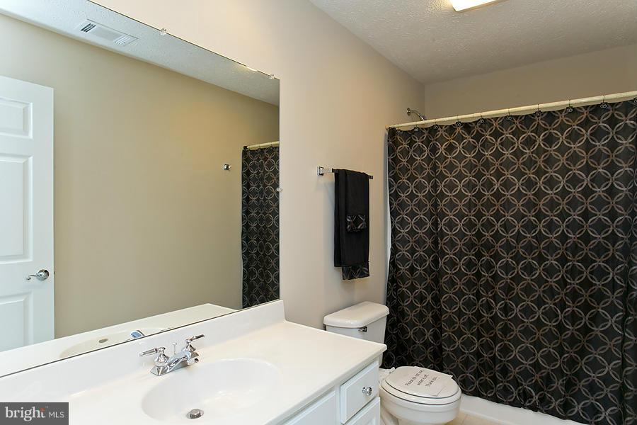 176 White Hall Road Winchester, VA 22603 - Photo 25 of 30 a bathroom with a sink and a toilet