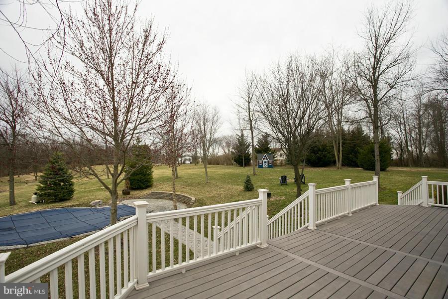 176 White Hall Road Winchester, VA 22603 - Photo 28 of 30 a view of a deck with large trees and wooden fence