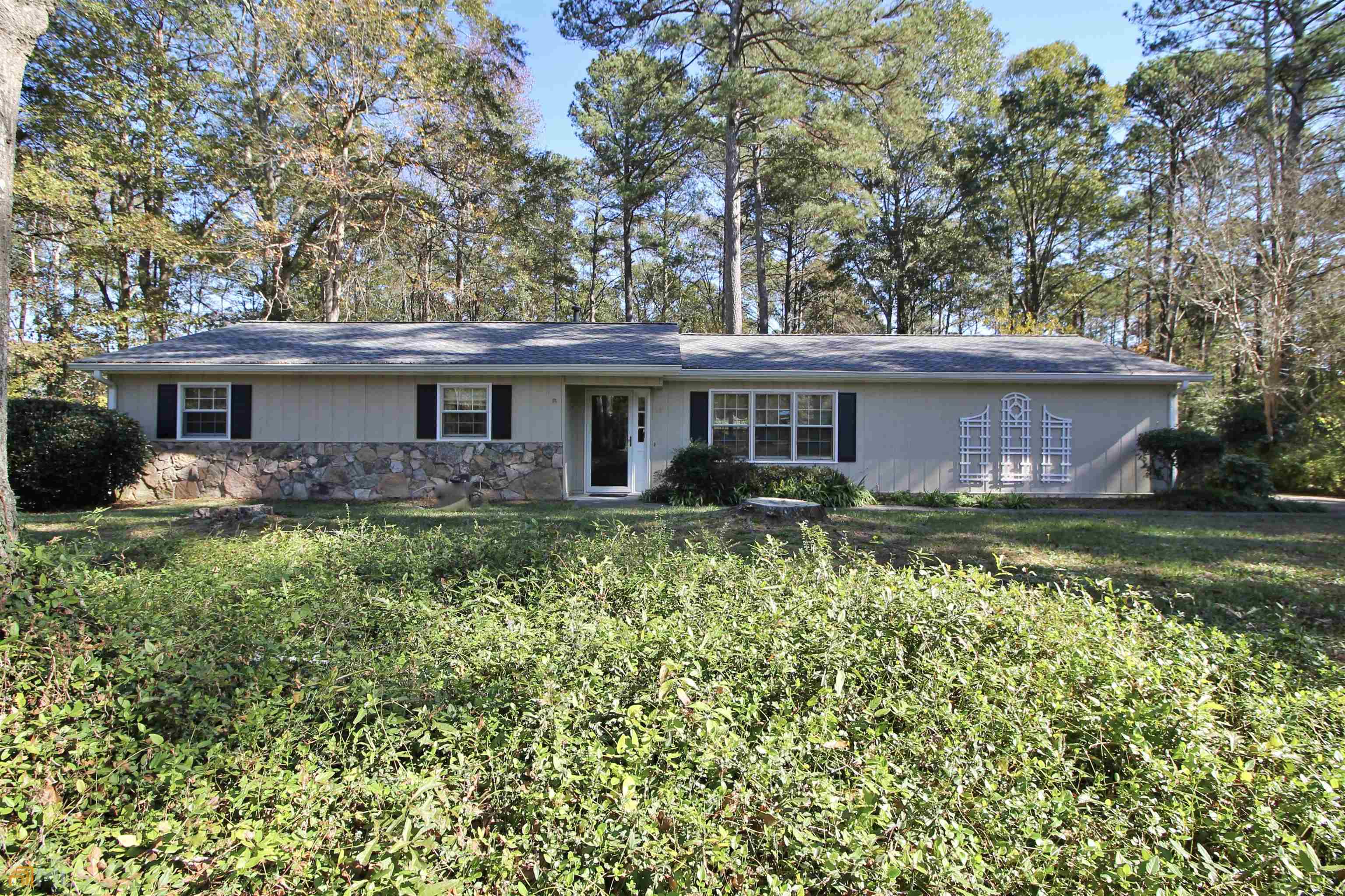 15 Deer Run Road Ellenwood, GA 30294 - Photo 1 of 1 a front view of a house with a yard table and chairs