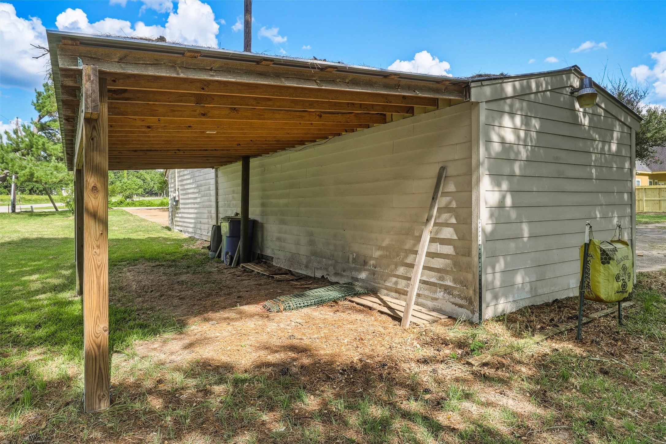 22923 Tomball Cemetery Road Tomball, TX 77377 - Photo 43 of 50 Extra covered storage area on north side of workshop.