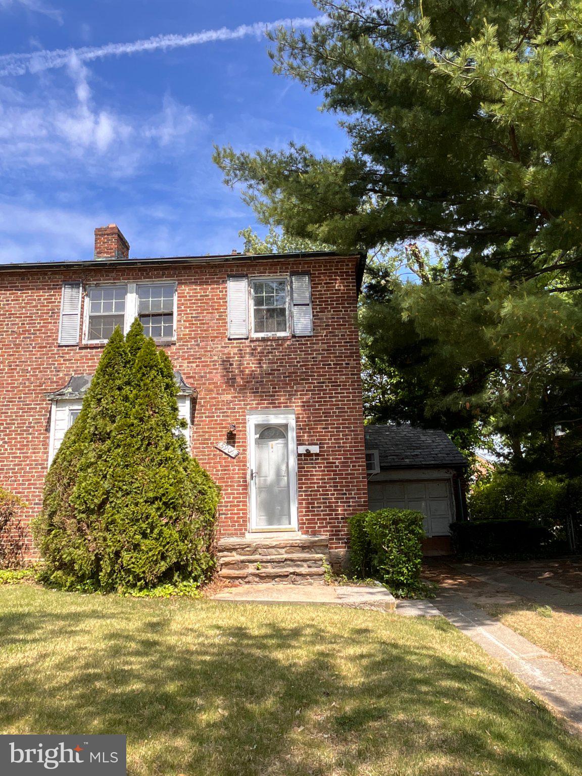 5906 Ayleshire Road Baltimore, MD 21239 - Photo 29 of 41 Charming brick home with lush greenery.