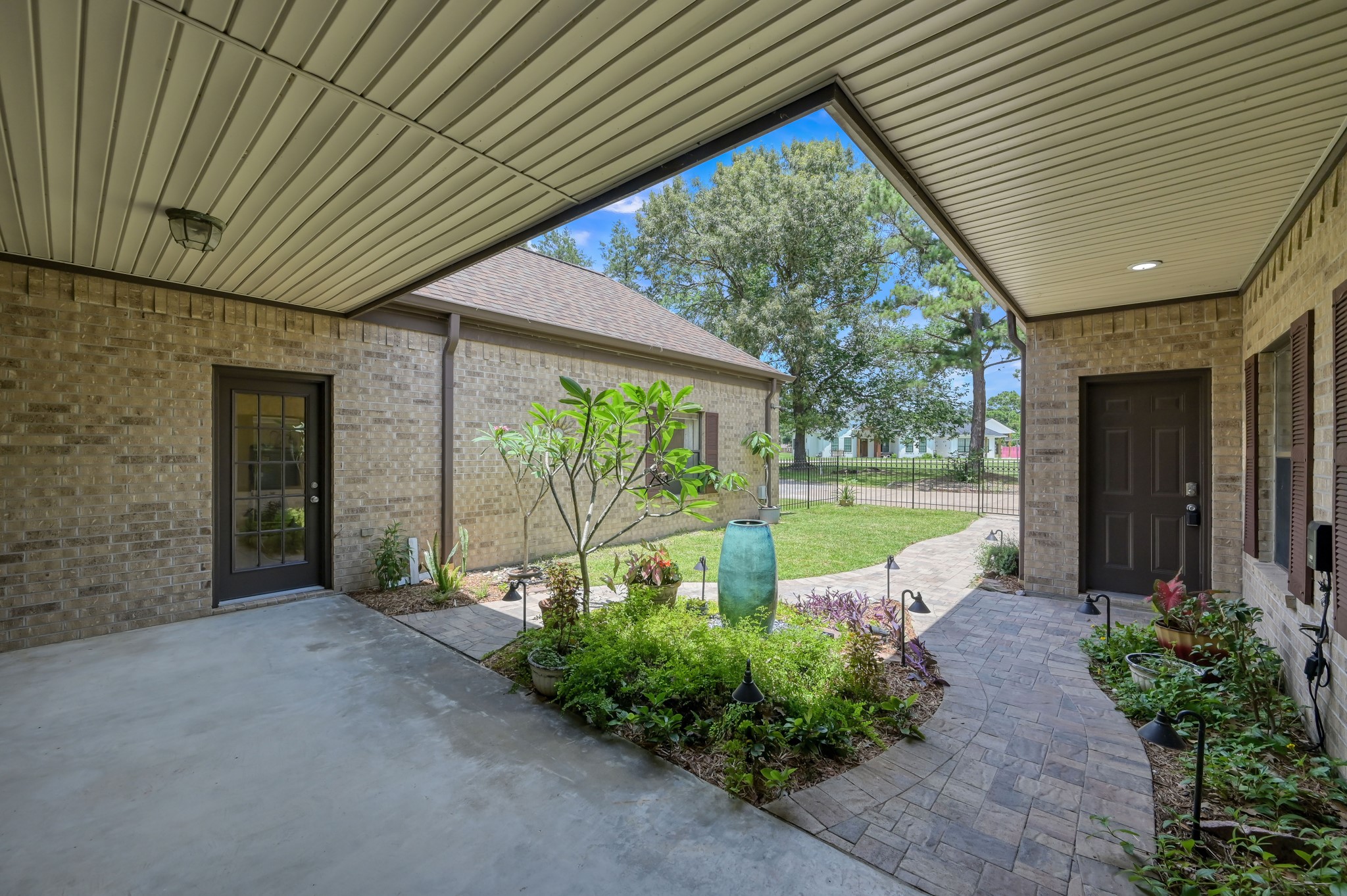 273 Augusta Drive Trinity, TX 75862 - Photo 6 of 50 Covered front patio with covered walkway from the garage to the front door.