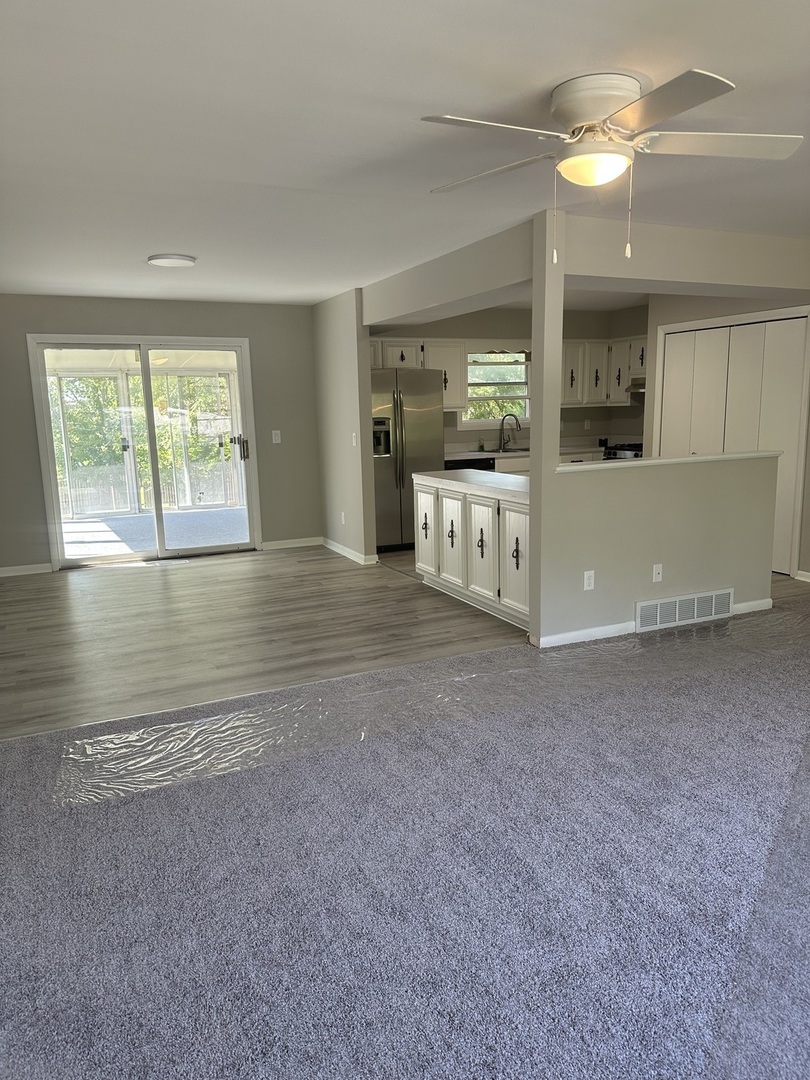 220 North Rosedale Avenue Aurora, IL 60506 - Photo 2 of 10 a view of an empty room with window and cabinet