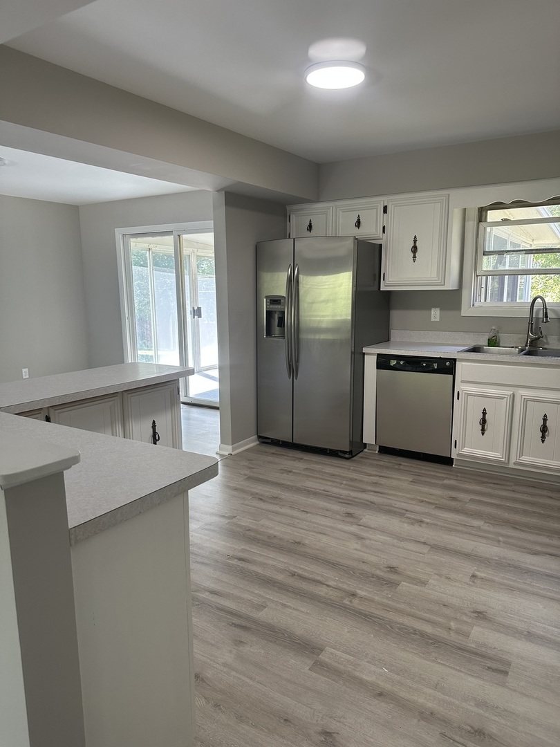 220 North Rosedale Avenue Aurora, IL 60506 - Photo 5 of 10 a kitchen with stainless steel appliances granite countertop a stove and a refrigerator