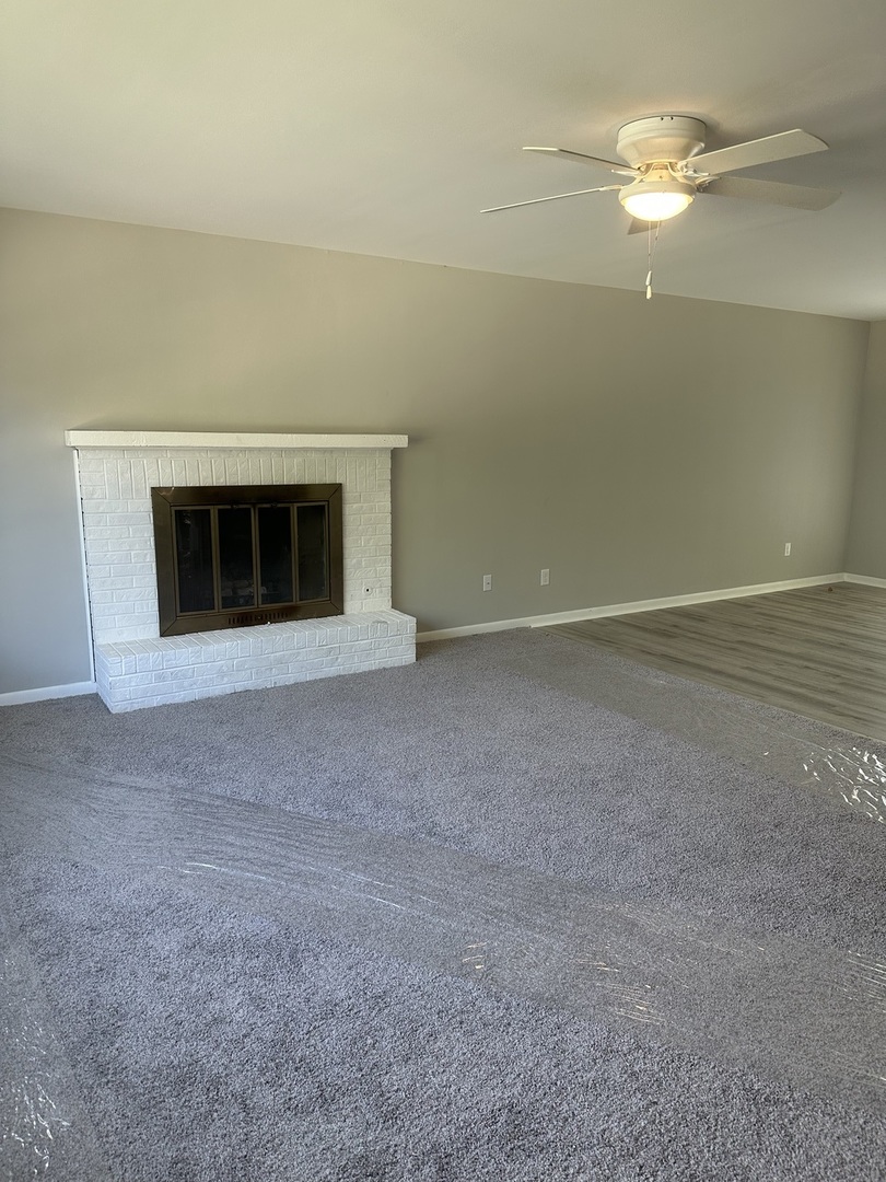 220 North Rosedale Avenue Aurora, IL 60506 - Photo 6 of 10 a view of an empty room with a fireplace