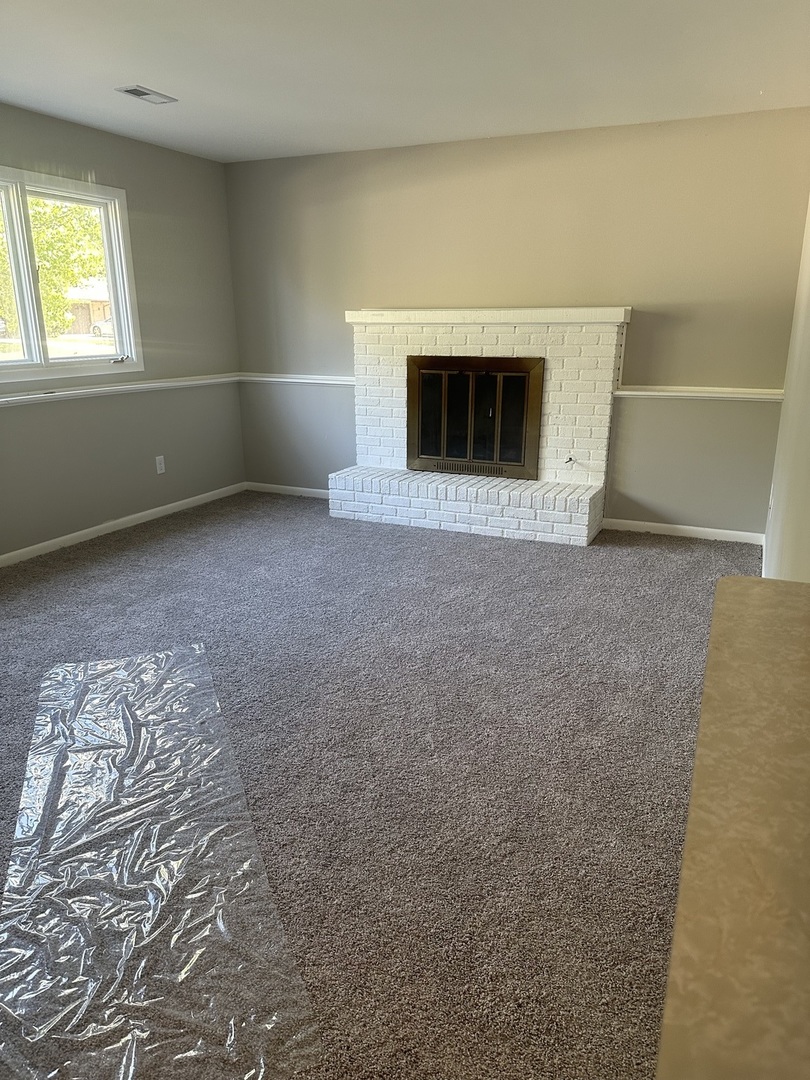 220 North Rosedale Avenue Aurora, IL 60506 - Photo 10 of 10 a view of empty room with a fireplace
