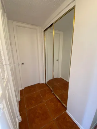 a bedroom with a bed and a rug