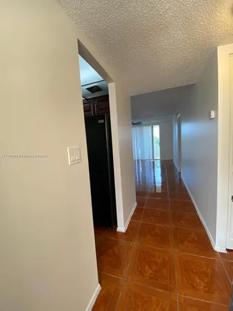 a view of gallery with wooden floor