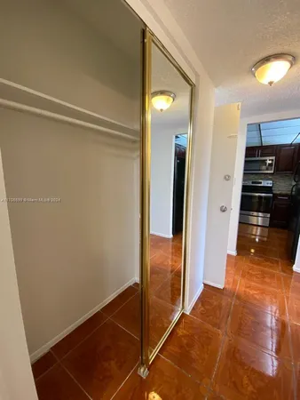 a view of a kitchen from the hallway