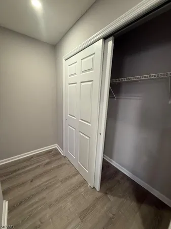 an empty room with wooden floor