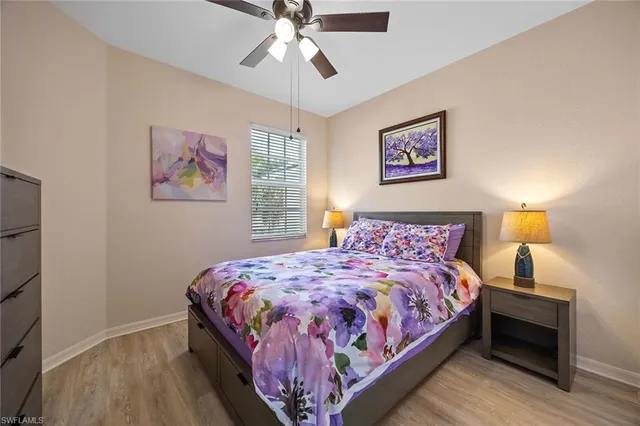 a bedroom with bed and a window