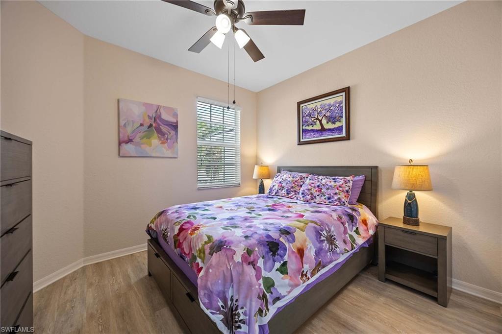 8365 Whisper Trace Way, Unit L204 Naples, FL 34114 - Photo 18 of 45 a bedroom with bed and a window