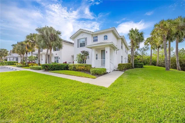 a view of house with outdoor space and swimming pool