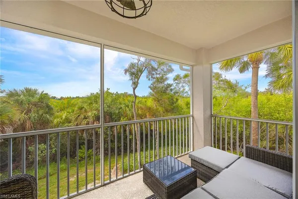 a view of a balcony with wooden floor