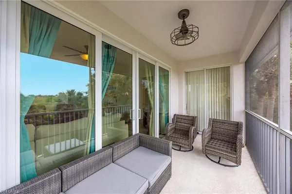 a room with furniture and a large window