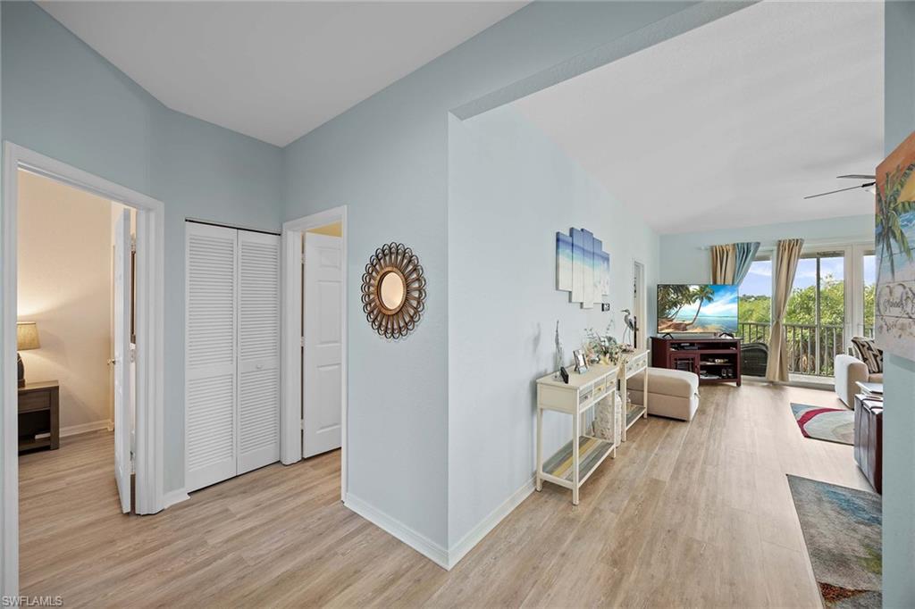 8365 Whisper Trace Way, Unit L204 Naples, FL 34114 - Photo 4 of 45 a view of a living room and dining room
