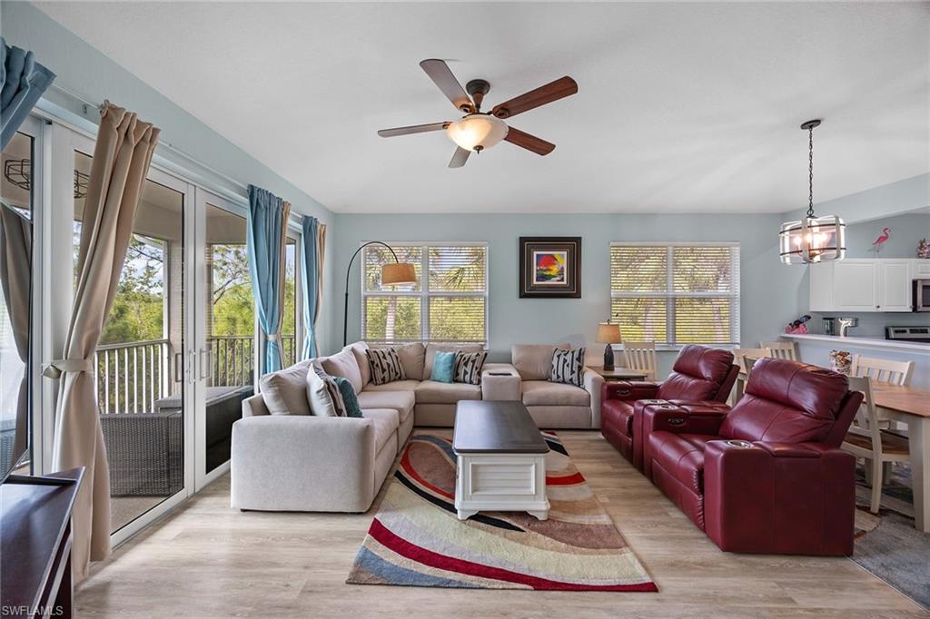 8365 Whisper Trace Way, Unit L204 Naples, FL 34114 - Photo 7 of 45 a living room with furniture ceiling fan and a window
