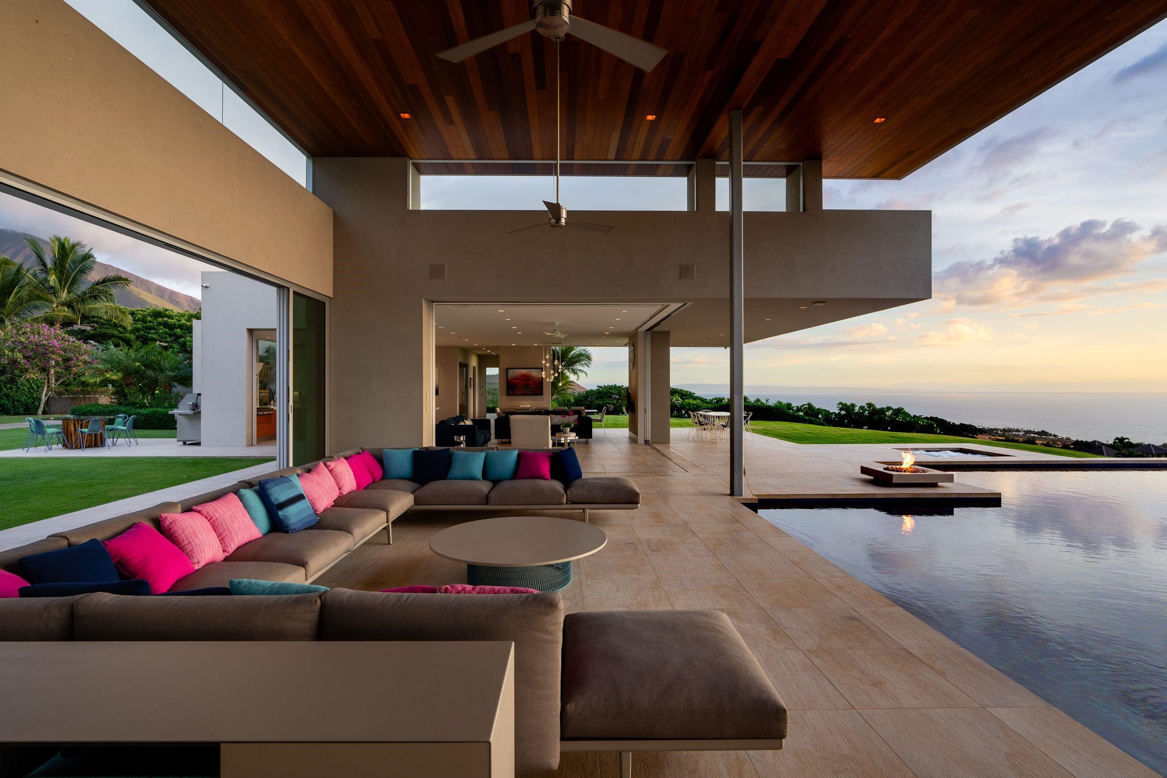 936 Punakea Loop Lahaina, HI 96761 - Photo 29 of 35 a living room with patio furniture and a floor to ceiling window