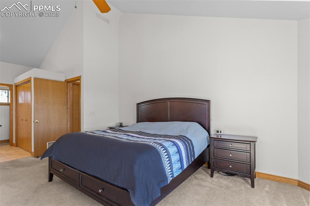 162 Ridge Top Drive Divide, CO 80814 - Photo 17 of 50 a bedroom with a bed and a night stand