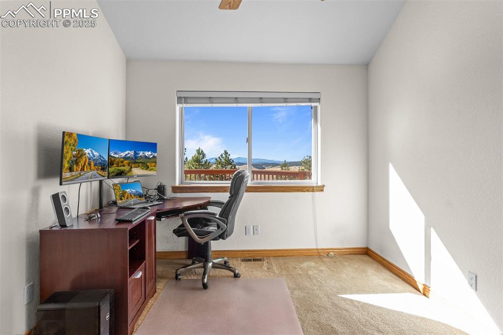 162 Ridge Top Drive Divide, CO 80814 - Photo 22 of 50 a view of a workspace with furniture and a window