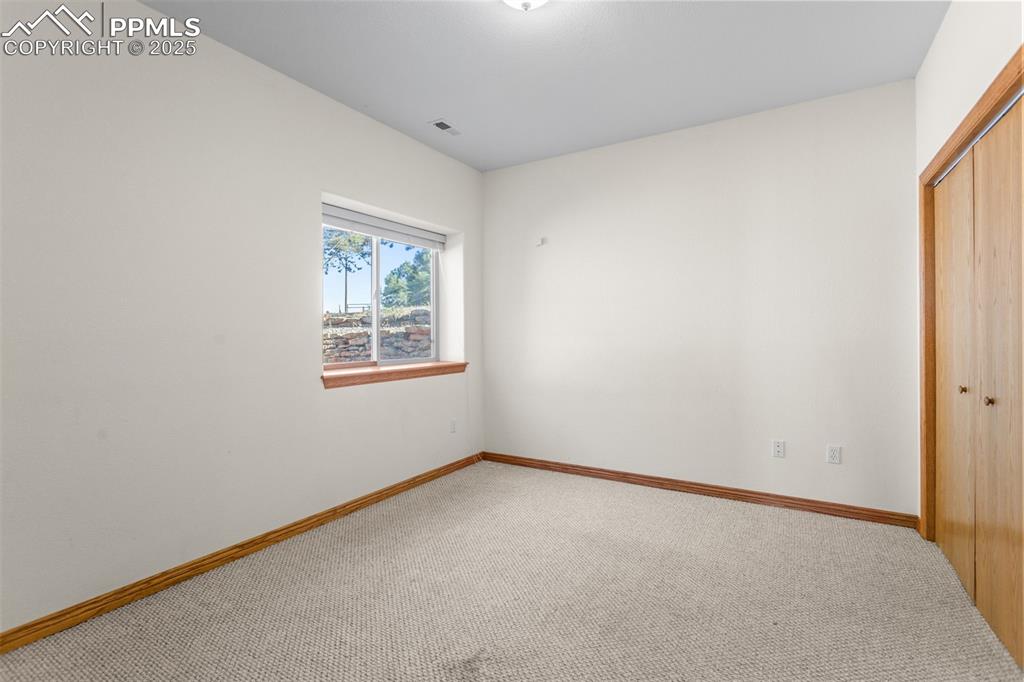162 Ridge Top Drive Divide, CO 80814 - Photo 29 of 50 an empty room with windows