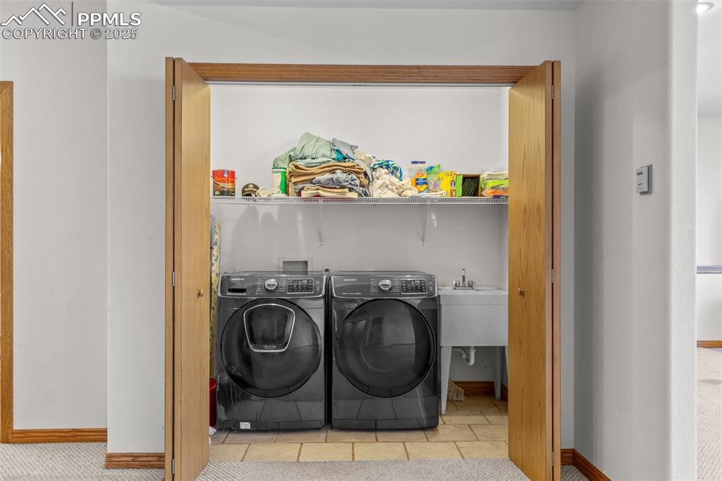 162 Ridge Top Drive Divide, CO 80814 - Photo 31 of 50 a utility room with dryer and washer