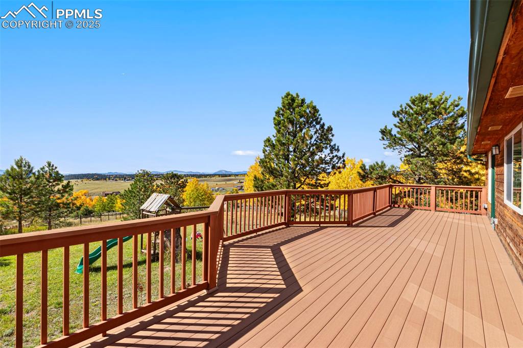 162 Ridge Top Drive Divide, CO 80814 - Photo 4 of 50 a view of balcony with wooden floor and outdoor seating
