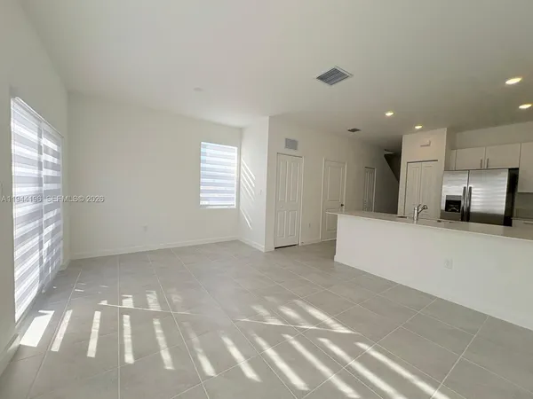 a view of an empty room with a window